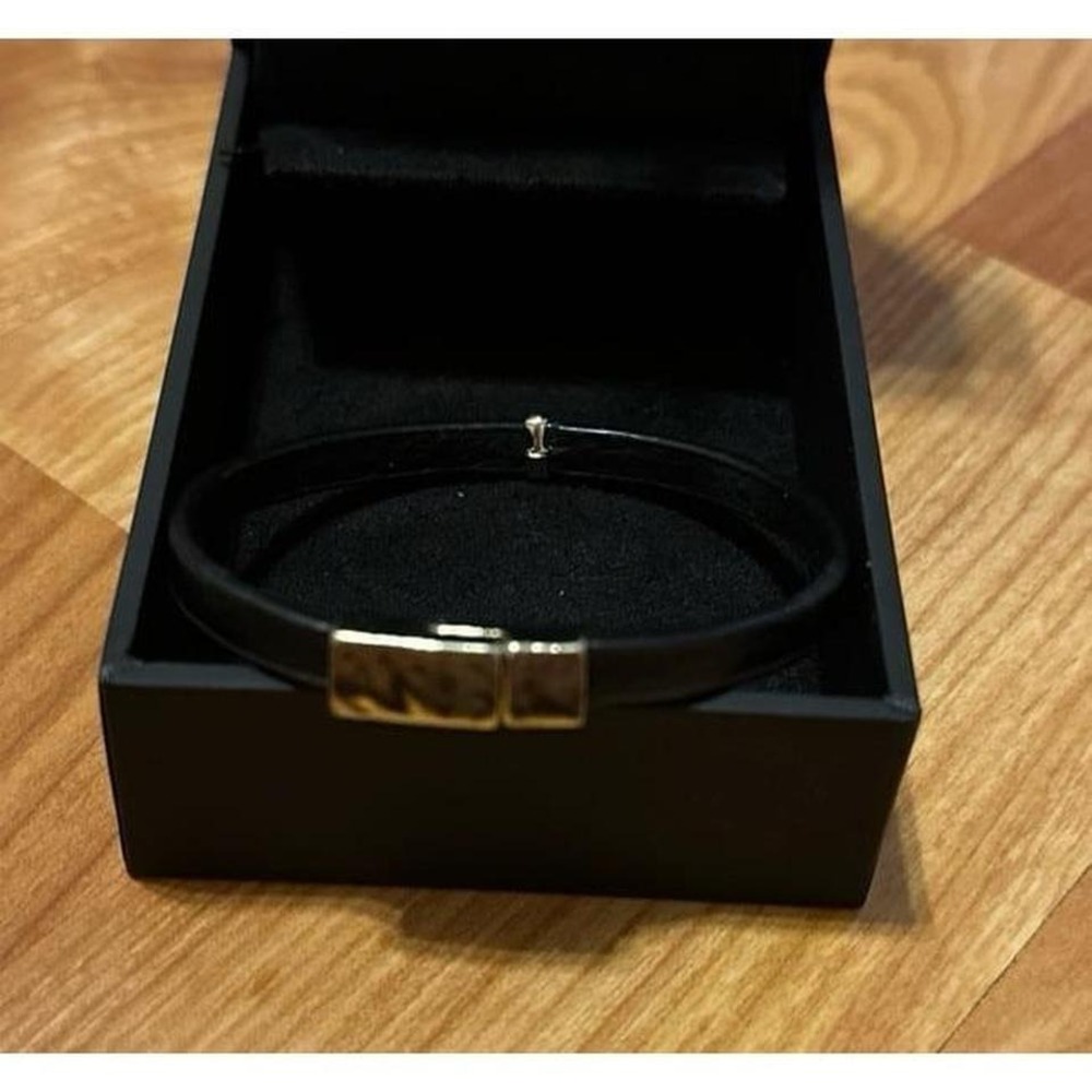 Black‎  Leather  Bracelet with a prominent silver toned interlocking metal clasp